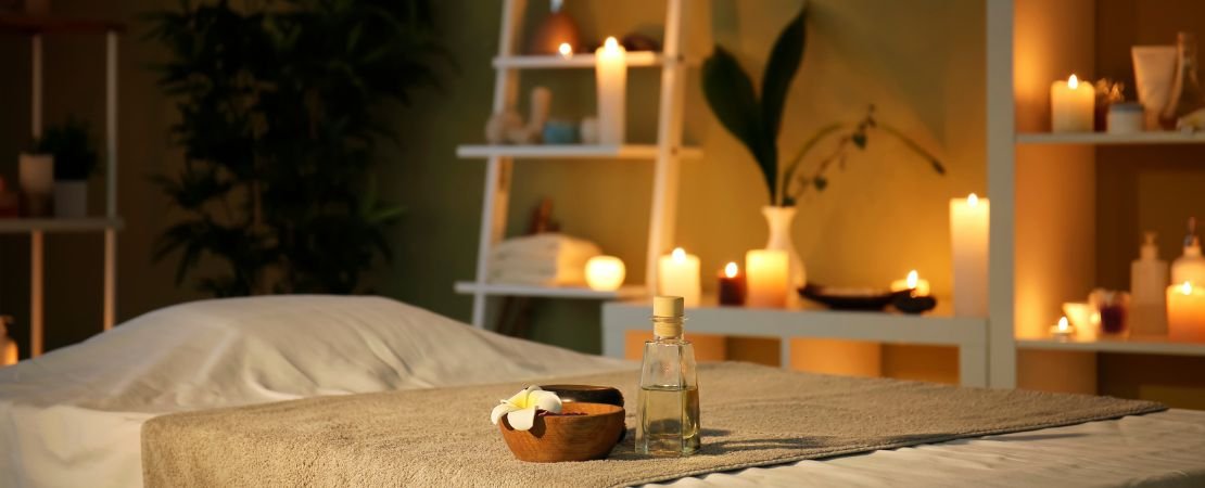 massage table in spa with candles
