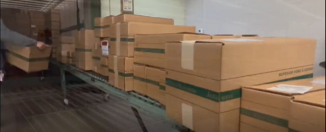boxed bare root roses being carefully loaded onto the truck