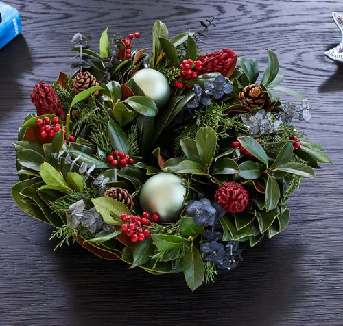 Wintergreen and Ruby Fresh Magnolia Centerpiece Image